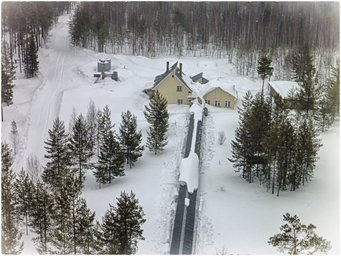 Tower station in March 2015. The station consists of an air conditioned bunker for scientific equipment and living houses. The pergola connects the house with the base of the tower so that the staff is protected against falling ice. Tower station in the snow